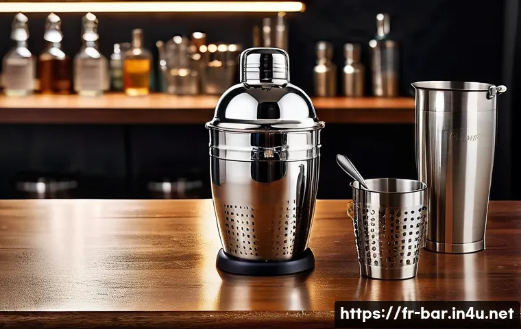 바텐더에게 필요한 기본 장비 - A professional bartender’s workstation featuring a stainless steel Boston shaker mid-action, with co...